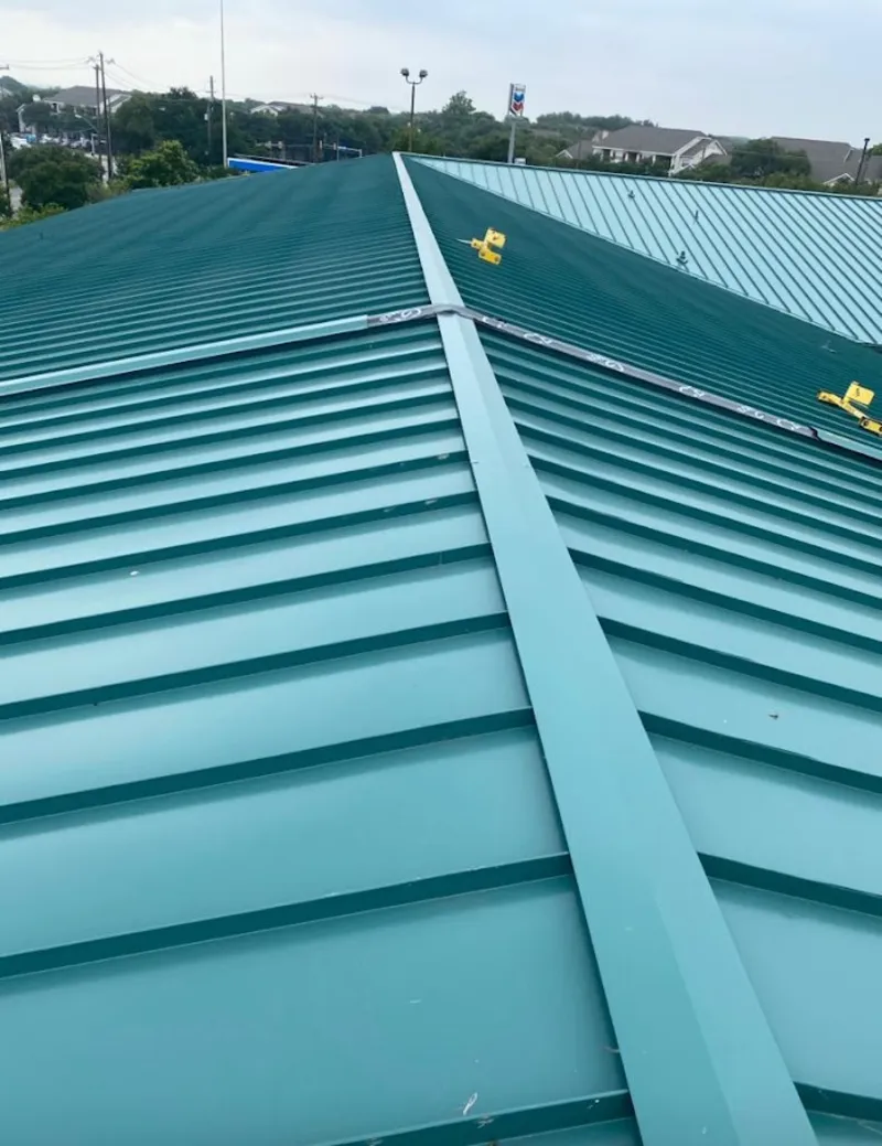 Green commercial metal roof ridge and valley for Metal Roof Repair in Larose